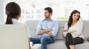 Psychologist helping a couple with relationship difficulties in the office